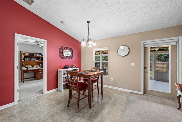 33 Bud Field Dr, Palm Coast, FL 32137 - dining space with a textured ceiling, vaulted ceiling, a chandelier, a ceiling fan, and baseboards
