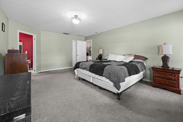 33 Bud Field Dr, Palm Coast, FL 32137 - bedroom featuring carpet flooring, a textured ceiling, and baseboards