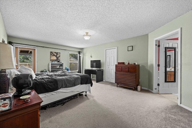 33 Bud Field Dr, Palm Coast, FL 32137 - bedroom with carpet flooring, a textured ceiling, and baseboards