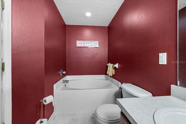 33 Bud Field Dr, Palm Coast, FL 32137 - full bathroom with toilet, a garden tub, vanity, a textured wall, and a textured ceiling