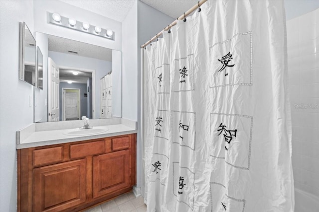 33 Bud Field Dr, Palm Coast, FL 32137 - full bath with vanity, a textured ceiling, and curtained shower
