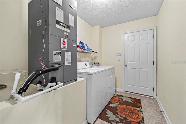33 Bud Field Dr, Palm Coast, FL 32137 - laundry area featuring separate washer and dryer, heating unit, a textured ceiling, and baseboards