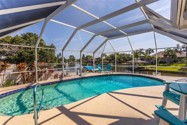 40 Cloverdale Ct N, Palm Coast, FL 32137 - outdoor pool featuring a water view, a patio area, boat lift, a dock, and glass enclosure