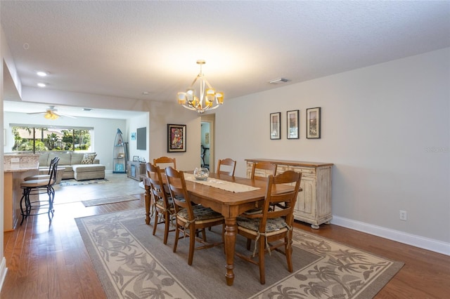 40 Cloverdale Ct N, Palm Coast, FL 32137 - dining room with a chandelier, light wood-type flooring, recessed lighting, baseboards, and a ceiling fan