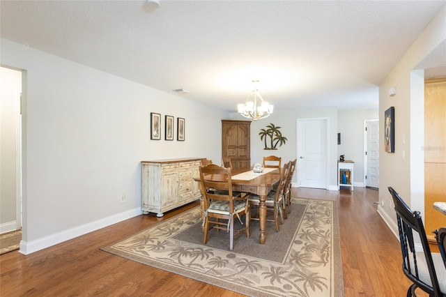 40 Cloverdale Ct N, Palm Coast, FL 32137 - dining area with a chandelier, wood finished floors, and baseboards