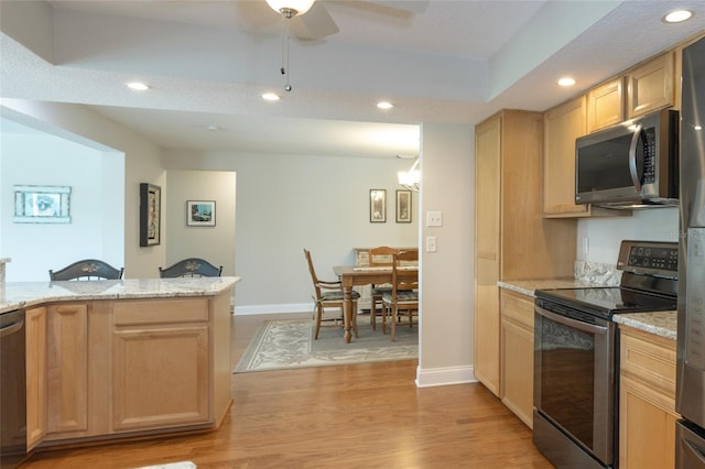 40 Cloverdale Ct N, Palm Coast, FL 32137 - kitchen featuring appliances with stainless steel finishes, light brown cabinetry, recessed lighting, and baseboards