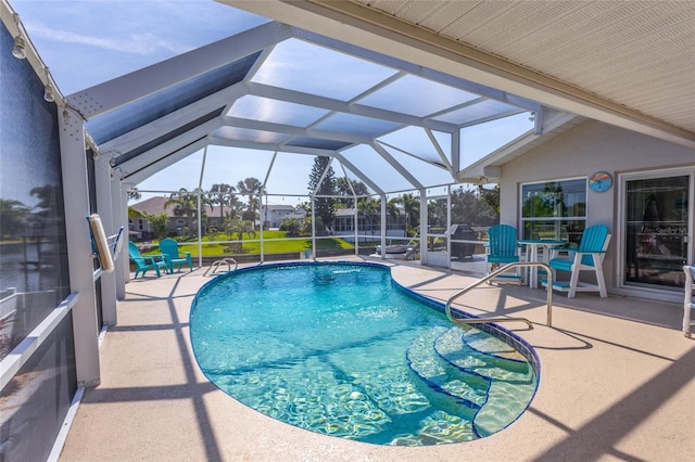 40 Cloverdale Ct N, Palm Coast, FL 32137 - outdoor pool with a patio area and glass enclosure