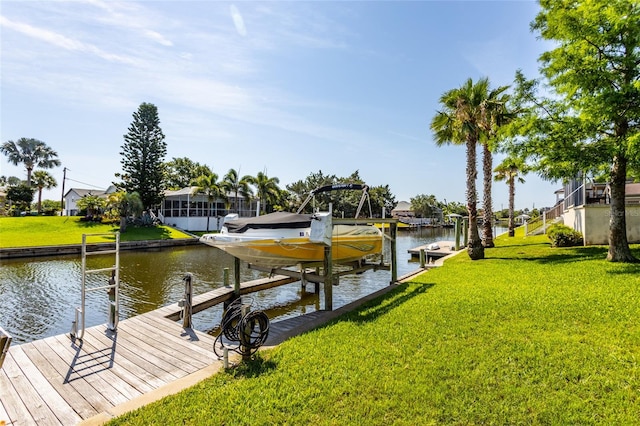 40 Cloverdale Ct N, Palm Coast, FL 32137 - dock with boat lift, a water view, a lawn, and a residential view