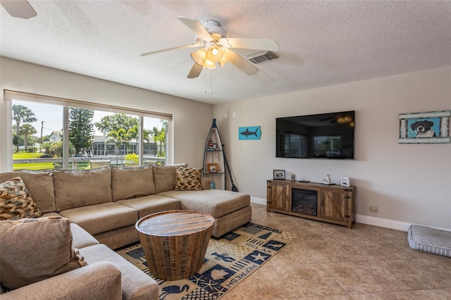 40 Cloverdale Ct N, Palm Coast, FL 32137 - living area featuring a ceiling fan, a textured ceiling, and baseboards