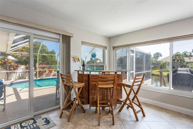 40 Cloverdale Ct N, Palm Coast, FL 32137 - sunroom / solarium featuring a water view