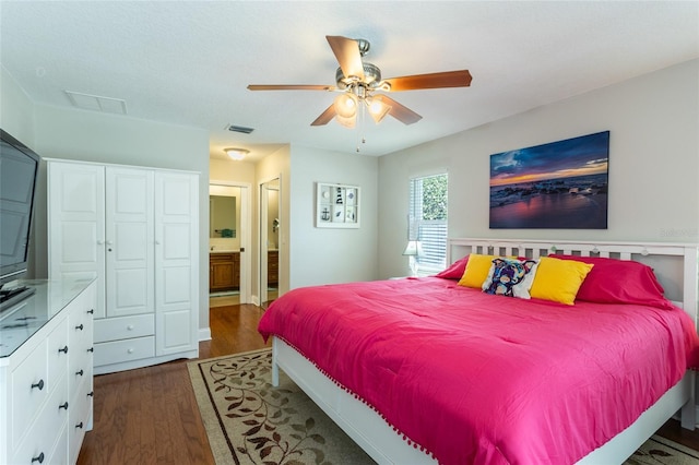 40 Cloverdale Ct N, Palm Coast, FL 32137 - bedroom featuring wood finished floors, ensuite bath, and ceiling fan