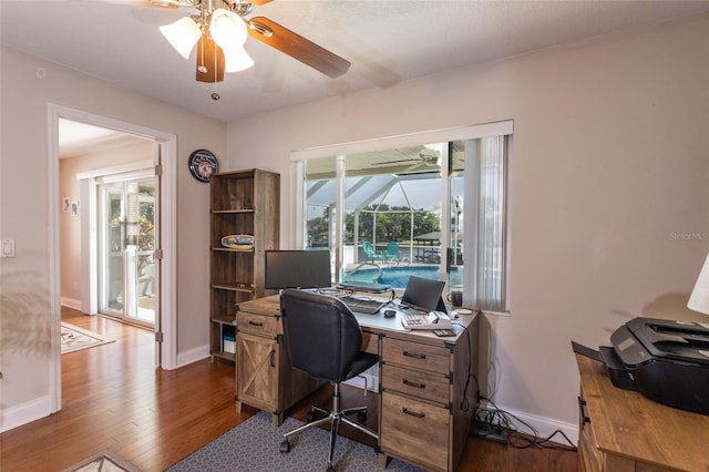 40 Cloverdale Ct N, Palm Coast, FL 32137 - office featuring a ceiling fan, wood finished floors, baseboards, and a sunroom