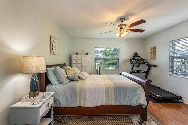 40 Cloverdale Ct N, Palm Coast, FL 32137 - bedroom featuring wood finished floors, a ceiling fan, and baseboards