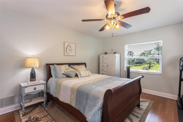 40 Cloverdale Ct N, Palm Coast, FL 32137 - bedroom with baseboards, wood finished floors, and a ceiling fan