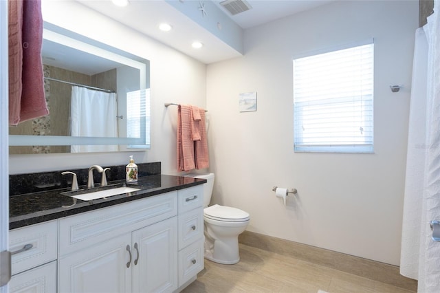 40 Cloverdale Ct N, Palm Coast, FL 32137 - full bathroom with toilet, vanity, recessed lighting, and baseboards