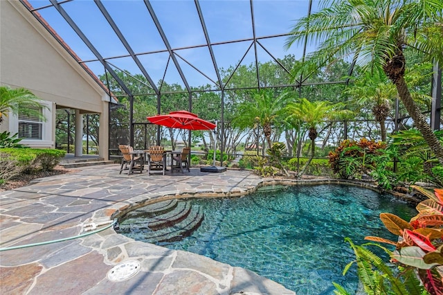 129 Front St, Palm Coast, FL 32137 - swimming pool featuring a patio, a lanai, and outdoor dining space