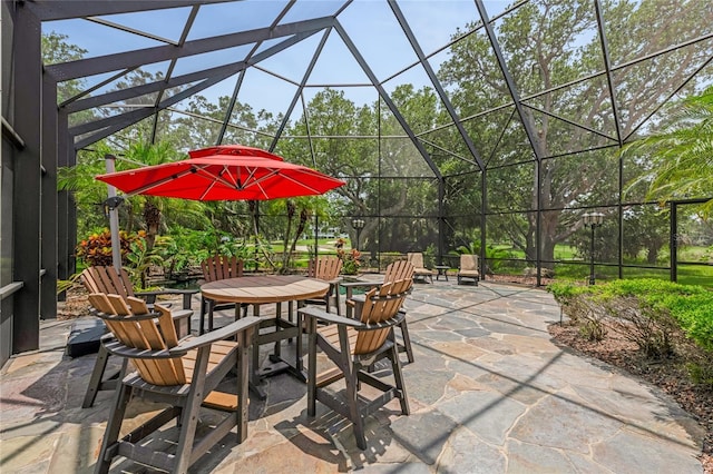 129 Front St, Palm Coast, FL 32137 - view of patio / terrace featuring outdoor dining space and glass enclosure