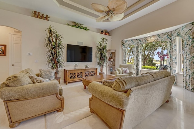 129 Front St, Palm Coast, FL 32137 - living room featuring arched walkways, ceiling fan, and a towering ceiling
