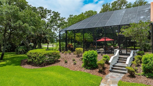 129 Front St, Palm Coast, FL 32137 - view of grassy yard with glass enclosure and a patio