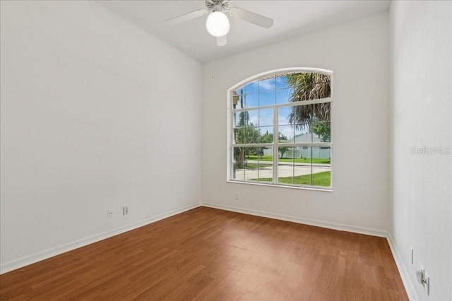 49 Ludlow Ln W, Palm Coast, FL 32137 - empty room with wood finished floors, ceiling fan, and baseboards