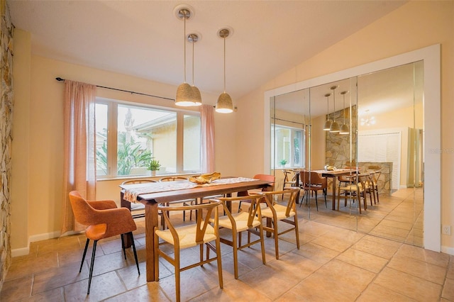 29 Cherrytree Ct, Palm Coast, FL 32137 - dining space featuring lofted ceiling and baseboards