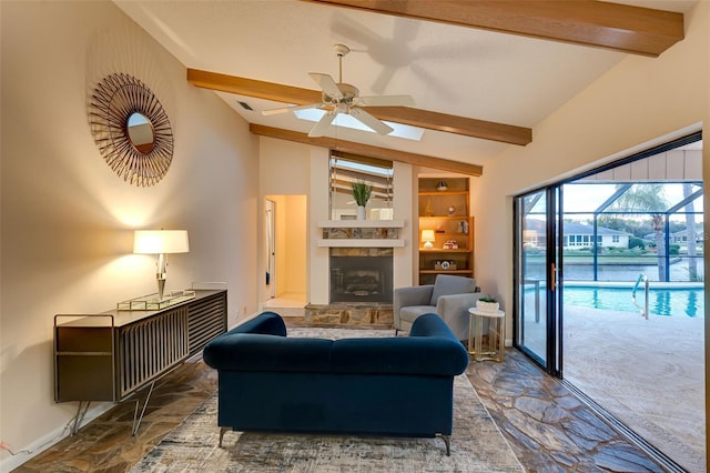 29 Cherrytree Ct, Palm Coast, FL 32137 - living room featuring ceiling fan, built in features, a stone fireplace, and baseboards