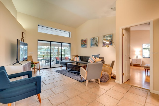 29 Cherrytree Ct, Palm Coast, FL 32137 - living room featuring healthy amount of natural light and high vaulted ceiling