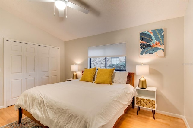 29 Cherrytree Ct, Palm Coast, FL 32137 - bedroom featuring wood finished floors, a closet, baseboards, a ceiling fan, and vaulted ceiling