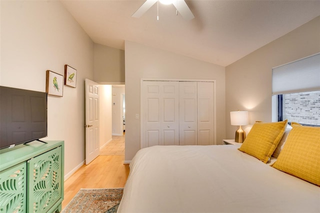 29 Cherrytree Ct, Palm Coast, FL 32137 - bedroom featuring light wood finished floors, a closet, lofted ceiling, a ceiling fan, and baseboards