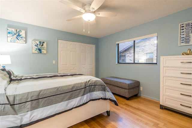 29 Cherrytree Ct, Palm Coast, FL 32137 - bedroom featuring light wood-style floors, a closet, baseboards, and ceiling fan