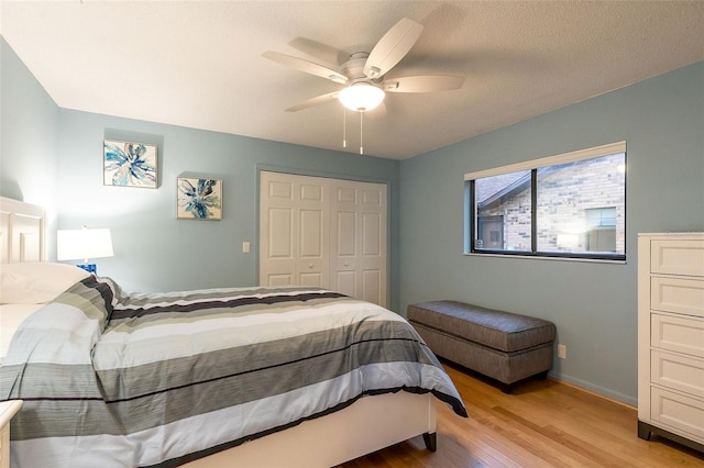 29 Cherrytree Ct, Palm Coast, FL 32137 - bedroom with wood finished floors, a closet, ceiling fan, and baseboards
