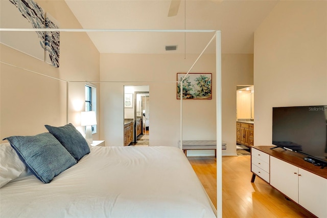 29 Cherrytree Ct, Palm Coast, FL 32137 - bedroom featuring light wood finished floors and connected bathroom