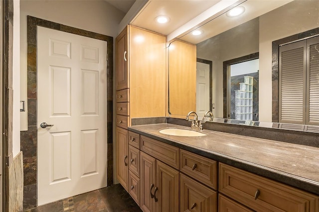 29 Cherrytree Ct, Palm Coast, FL 32137 - bathroom with vanity, a closet, and stone finish floors