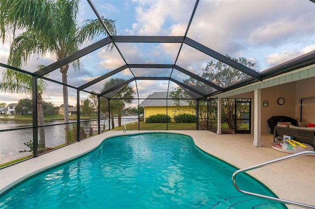 29 Cherrytree Ct, Palm Coast, FL 32137 - outdoor pool with a patio area, a water view, and glass enclosure