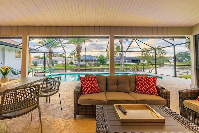29 Cherrytree Ct, Palm Coast, FL 32137 - view of patio / terrace with outdoor lounge area, an outdoor pool, glass enclosure, a residential view, and a water view