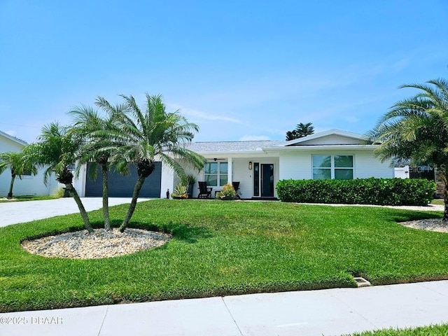 13 Sunrise Ave, Ormond Beach, FL 32176 - ranch-style house featuring a garage, a front yard, and driveway