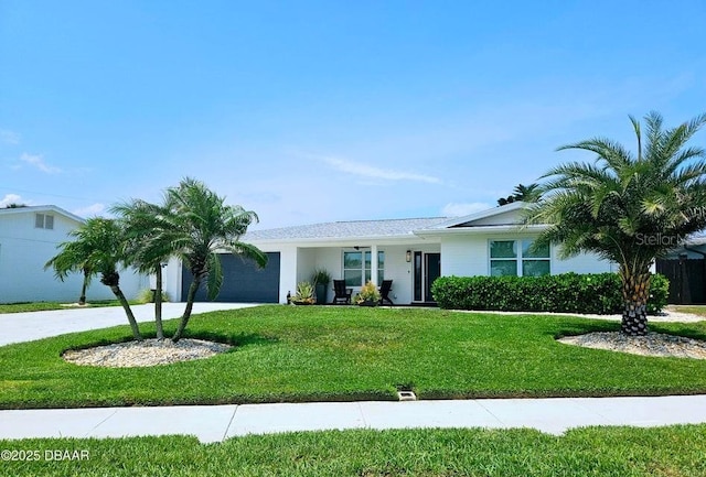 13 Sunrise Ave, Ormond Beach, FL 32176 - ranch-style home with a garage, concrete driveway, and a front lawn