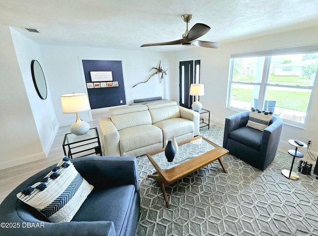 13 Sunrise Ave, Ormond Beach, FL 32176 - living room with ceiling fan, baseboards, and wood finished floors