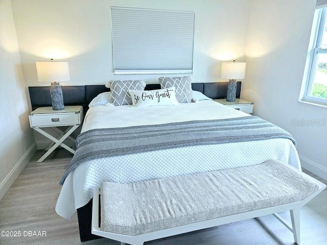 13 Sunrise Ave, Ormond Beach, FL 32176 - bedroom with baseboards and light wood finished floors