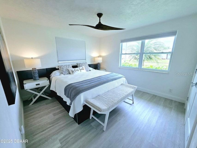 13 Sunrise Ave, Ormond Beach, FL 32176 - bedroom with wood finished floors, baseboards, and ceiling fan