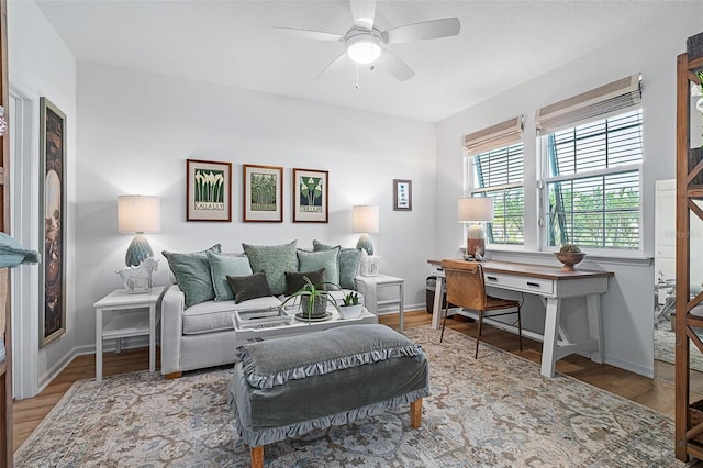 100 Las Casitas Blvd, Palm Coast, FL 32137 - living room with a ceiling fan, wood finished floors, baseboards, and an office area