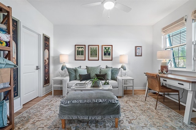 100 Las Casitas Blvd, Palm Coast, FL 32137 - living area featuring a ceiling fan, a desk, wood finished floors, and baseboards
