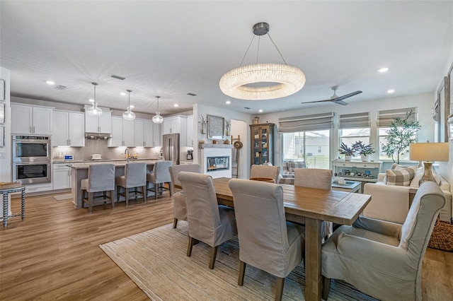 100 Las Casitas Blvd, Palm Coast, FL 32137 - dining area with light wood-style flooring, recessed lighting, and ceiling fan