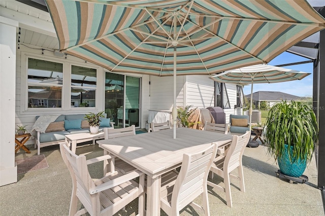 100 Las Casitas Blvd, Palm Coast, FL 32137 - view of patio featuring outdoor dining area and an outdoor living space
