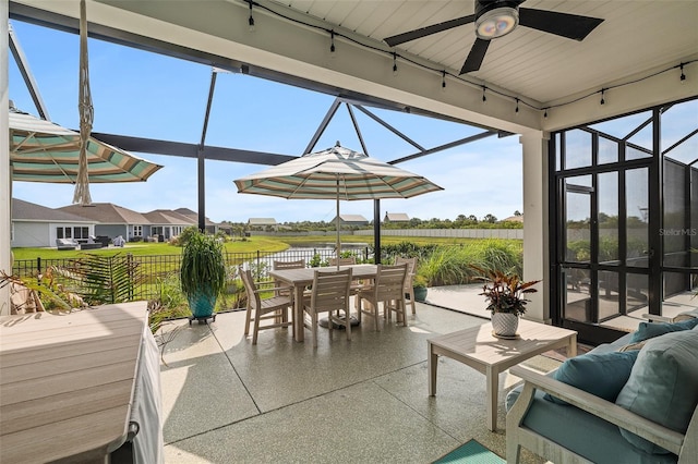 100 Las Casitas Blvd, Palm Coast, FL 32137 - view of patio / terrace with outdoor dining area, ceiling fan, a water view, and a lanai