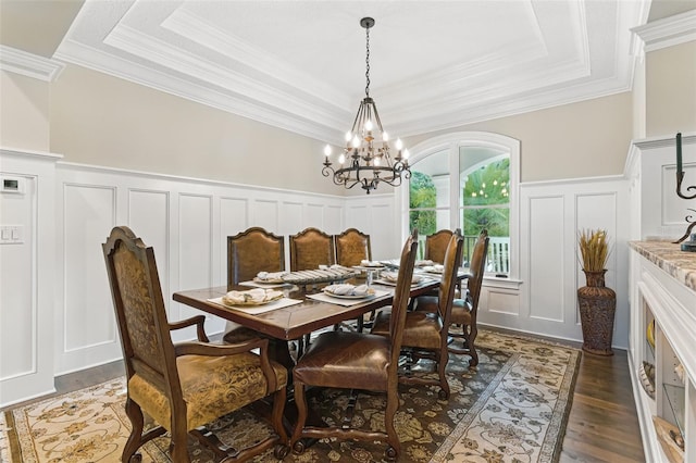 140 Monterey Bay Ln, Green Cove Springs, FL 32043 - dining room with a decorative wall, a chandelier, ornamental molding, a tray ceiling, and dark wood-type flooring