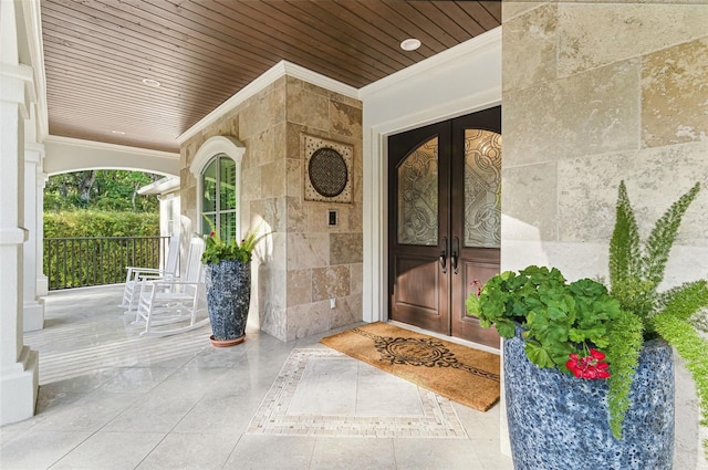 140 Monterey Bay Ln, Green Cove Springs, FL 32043 - view of exterior entry featuring french doors and covered porch