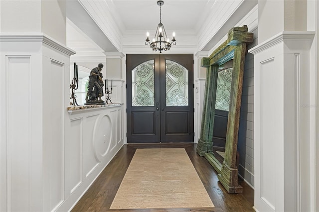 140 Monterey Bay Ln, Green Cove Springs, FL 32043 - entrance foyer with a chandelier, a decorative wall, dark wood-type flooring, crown molding, and french doors