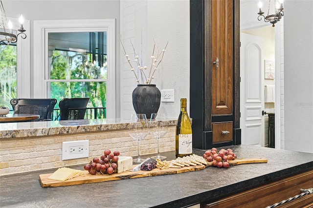 140 Monterey Bay Ln, Green Cove Springs, FL 32043 - detailed view of a chandelier and dark countertops