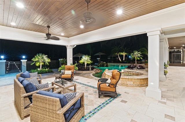 140 Monterey Bay Ln, Green Cove Springs, FL 32043 - patio at night with a patio area, an outdoor pool, ceiling fan, and an outdoor hangout area
